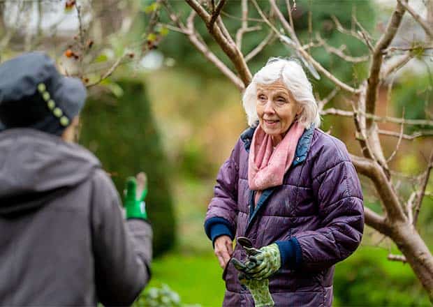 Older woman gardening.