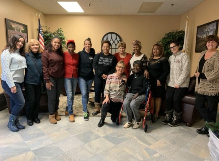 RI college students pictured with Charlesgate residents for intergen class closing party