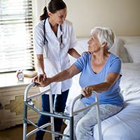 older woman receiving home medical care.